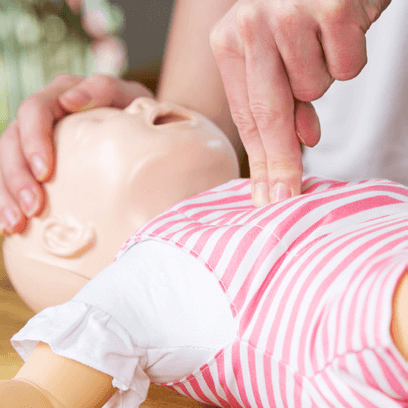 Hand on Baby doll CPR